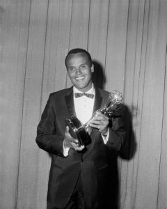 Harry Belafonte winning one of his many awards