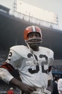 American football player, running back Jim Brown, #32 of the Cleveland Browns, stands on the field during a game. Jim Brown played for the Browns from 1957-1965. (Photo by Focus on Sport via Getty Images)
