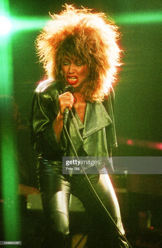 Tina Turner performing onstage at Wembly Stadium, 1985