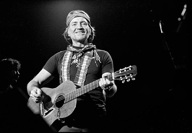 Solo picture of Willie Nelson in concert in Atlanta, DEcember 11, 1981.