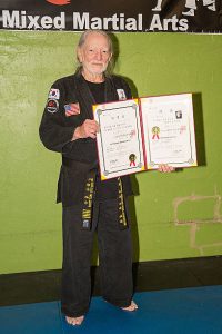 Willie Nelson being awarded his fifth degree black belt in the art of Gong Kwon Yu Sul. April 28, 2014 in Austin, Texas.