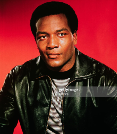 Young Jim Brown in leather jacket