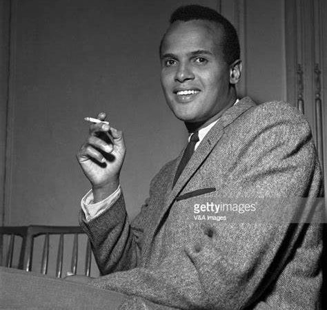 Young Harry Belafonte smoking a cigarette