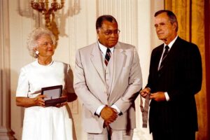 James Earl Jones with then President Bush and his wife Barbara Bush receiving a medal.