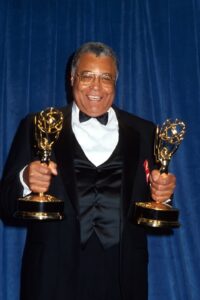 James Earl Jones holding two Tony awards.