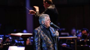 William Shatner performing with an orchestra.