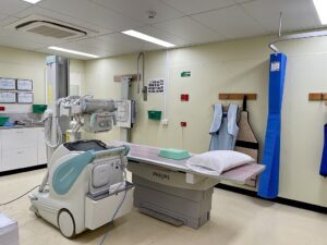 A hospital room with hi tech machines.