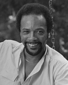 A young Quincy Jones with a goatee.