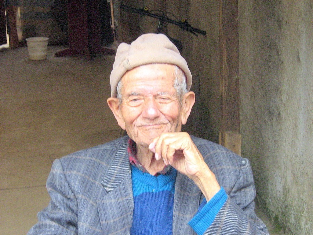 Dr. Tucker sitting and smiling.