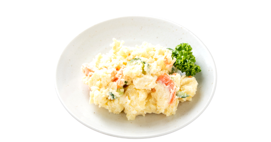 Creamy Korean Gamja Salad made with mashed potatoes, carrots, cucumbers, and herbs served on a white plate.