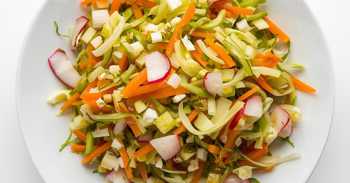 Shredded cabbage salad with carrots and radishes, lightly dressed and served as a simple Tibetan-style vegetable salad